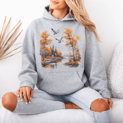 This design captures a stunning autumn forest scene, complete with vibrant golden leaves, a tranquil creek, and graceful geese soaring across the sky.